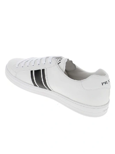 Shop Prada Embossed Logo Sneakers In White