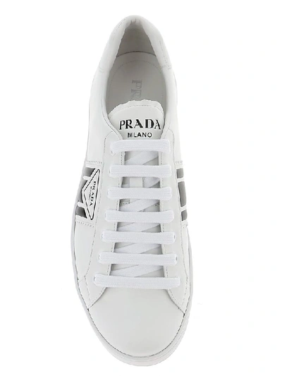 Shop Prada Embossed Logo Sneakers In White