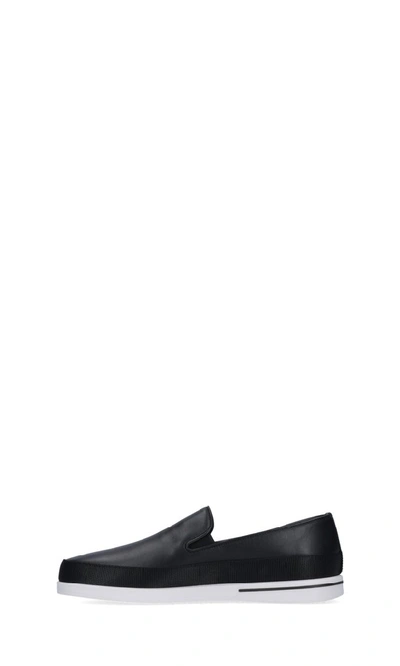 Shop Prada Logo Slip On Sneakers In Black
