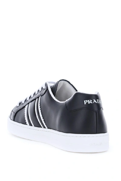 Shop Prada Embossed Logo Sneakers In Black