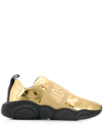 Shop Moschino Teddy Logo Strap Sneakers In Gold