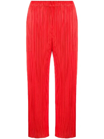 Shop Issey Miyake Cropped Pleated Trousers In Red