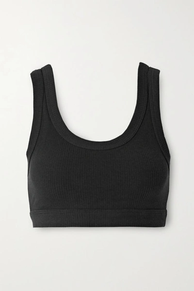 Shop Alo Yoga Wellness Ribbed Stretch Sports Bra In Black