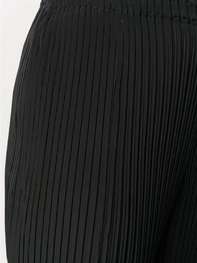 Shop Issey Miyake Pleated Trousers In Black