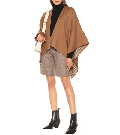 Shop Burberry Icon Stripe Wool Cape In Brown