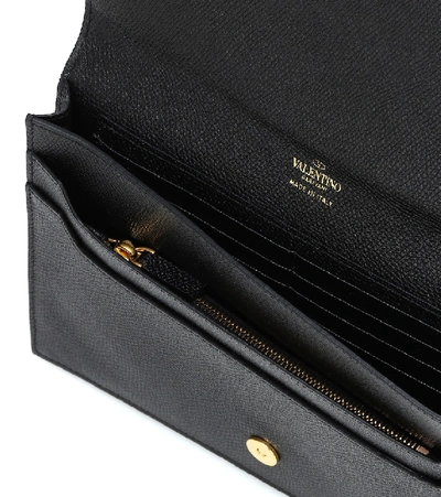 Shop Valentino Vlogo Leather Pouch In Black