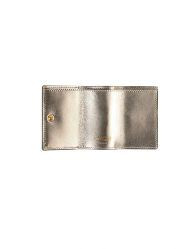 Shop Moschino Wallet In Gold