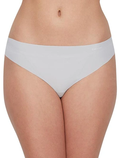 Shop Calvin Klein Invisibles Thong In Jet Gray