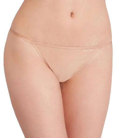 Shop Calvin Klein Microfiber String Bikini In Bare