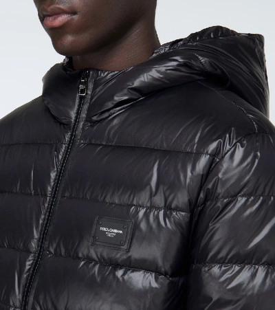 Shop Dolce & Gabbana Shiny Down Jacket With Plaque In Black