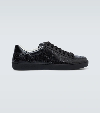 Shop Gucci Ace Gg Embossed Sneakers In Black