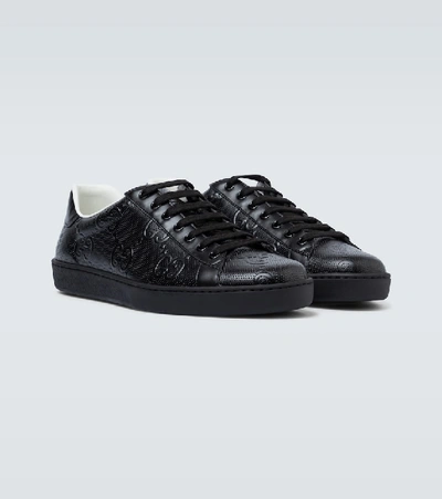 Shop Gucci Ace Gg Embossed Sneakers In Black