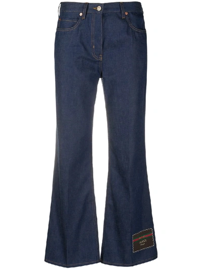 Shop Gucci Flared Logo Patch Jeans In Blue