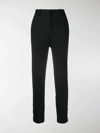 Shop Versace High-waisted Trousers In Black