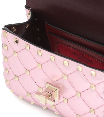 Shop Valentino Rockstud Spike Micro Crossbody Bag In Pink