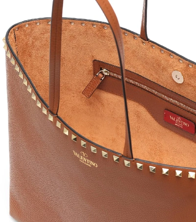 Shop Valentino Rockstud Medium Leather Tote In Brown