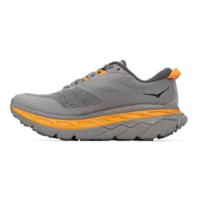 Shop Hoka One One Grey And Orange Stinson Atr 6 Sneakers In Grey/orange