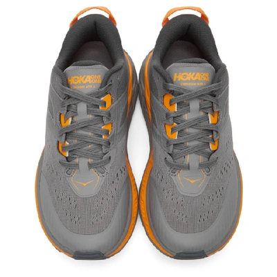 Shop Hoka One One Grey And Orange Stinson Atr 6 Sneakers In Grey/orange