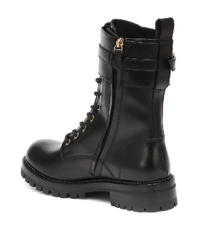 Shop Versace Safety Pin Leather Ankle Boots In Black