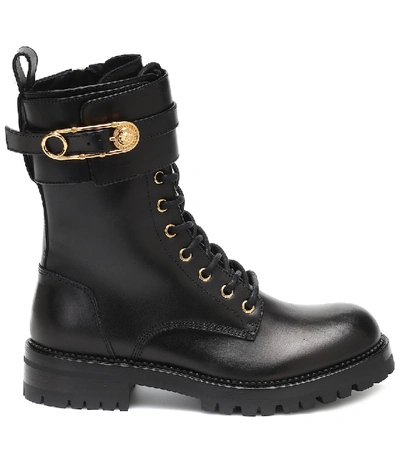 Shop Versace Safety Pin Leather Ankle Boots In Black