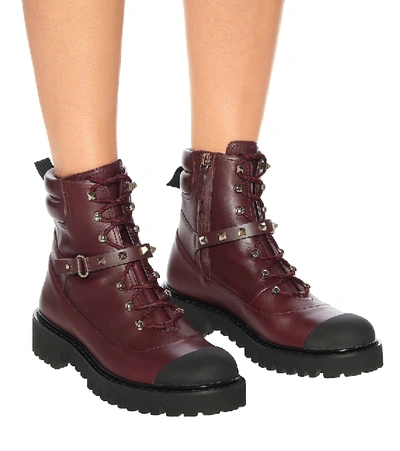 Shop Valentino Rockstud Leather Ankle Boots In Red