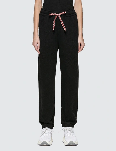 Shop Burberry Embroidered Logo Cotton Trackpants In Black