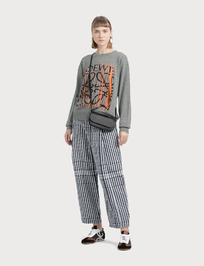 Shop Loewe Check Carrot Trousers In Black