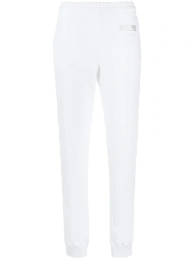 Shop Moschino High-waisted Track Pants In White