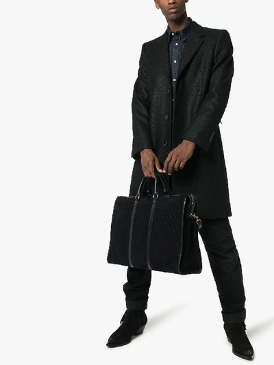 Shop Saint Laurent Black Monogram Embossed Leather Tote Bag