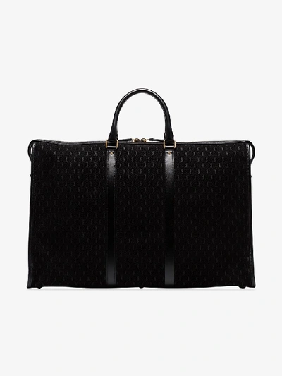 Shop Saint Laurent Black Monogram Embossed Leather Tote Bag