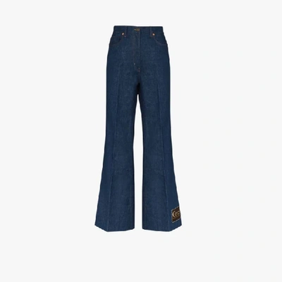 Shop Gucci Blue Logo Patch Flared Jeans