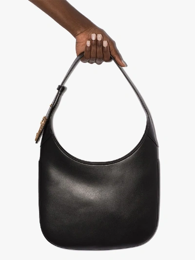 Shop Versace Black Virtus Saddle Shoulder Bag