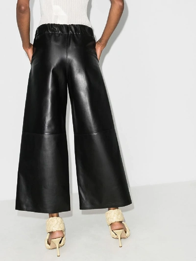 Shop Loewe Cropped Wide Leg Leather Trousers In Black
