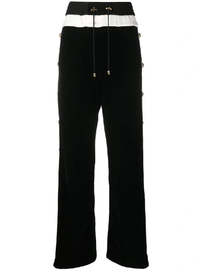Shop Balmain Buttoned Wide-leg Trousers In Black