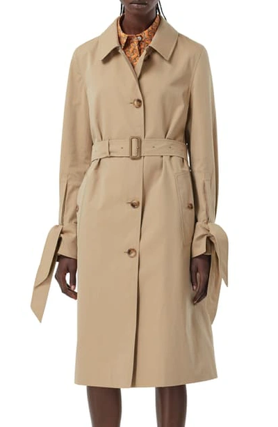 Shop Burberry Tie Cuff Single Breasted Trench Coat In Honey