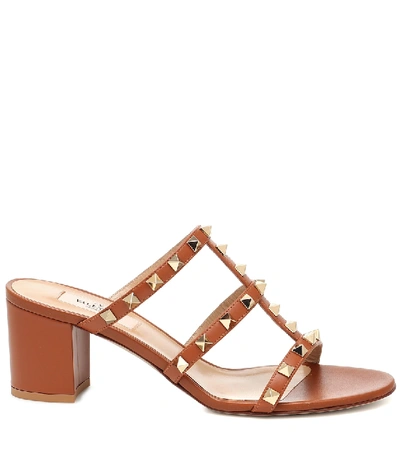 Shop Valentino Rockstud Leather Sandals In Brown