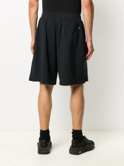 Shop Vetements Knee Length Skull Print Shorts In Black