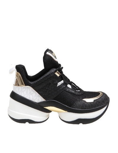Shop Michael Kors Olympia Trainer Sneakers In Black/gold