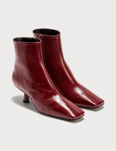 Shop By Far Lange Bordeaux Creased Leather Boots In Red