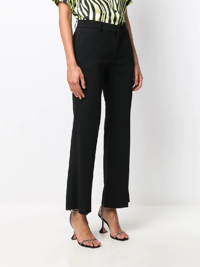 Shop Gucci Embroidered Flared Trousers In Black