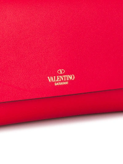 Shop Valentino Rockstud Clutch In Red