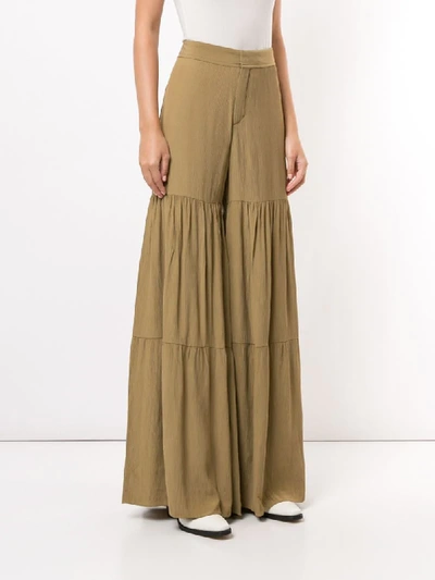Shop Chloé High-waisted Flared Trousers In Green