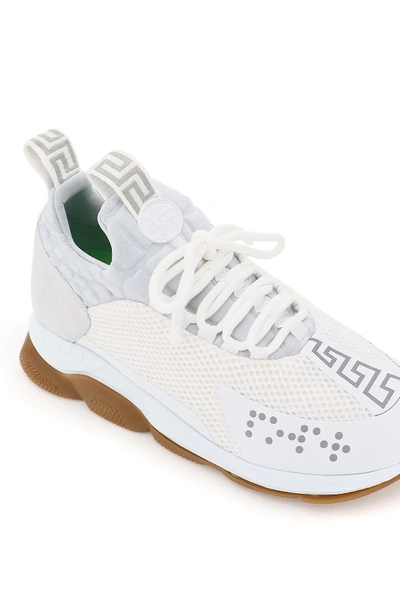 Shop Versace Cross Chainer Sneakers In White