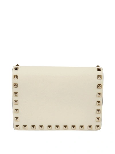 Shop Valentino Rockstud Leather Clutch In Ivory Color In Cream