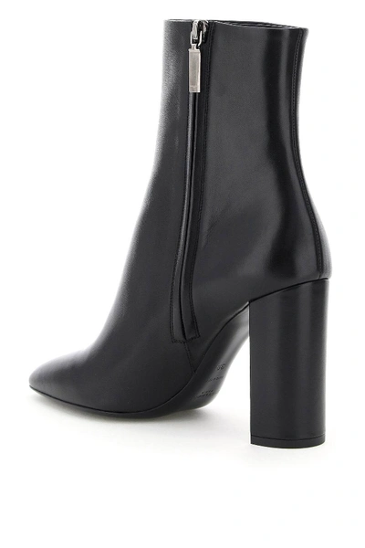 Shop Saint Laurent Lou Leather Ankle Boots In Black