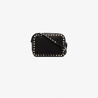 Shop Valentino Rockstud Leather Crossbody Bag In Black