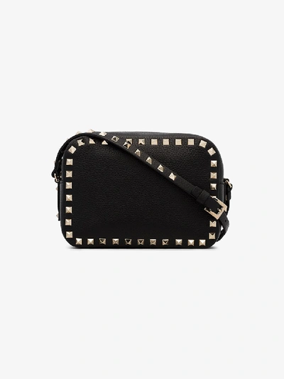 Shop Valentino Rockstud Leather Crossbody Bag In Black