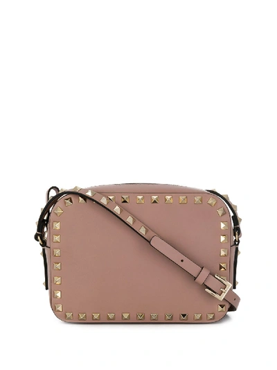 Shop Valentino Rockstud Leather Crossbody Bag In Pink
