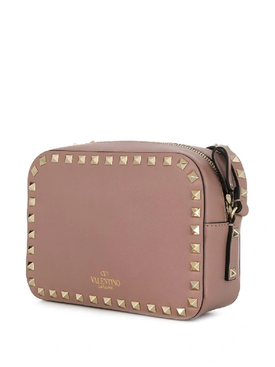 Shop Valentino Rockstud Leather Crossbody Bag In Pink