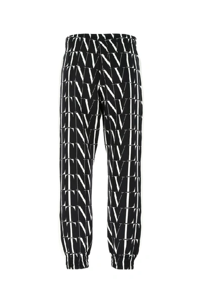 Shop Valentino Vltn Times Print Pants In Multi